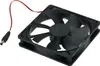 A black square fan with a black frame and a red and black wire with a connector. Produktbild-Vorschau