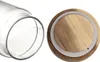 A close-up view of the opening of a glass jar and its wooden lid with a white seal. Náhled obrázku produktu