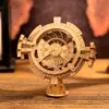 A wooden 3D puzzle of a perpetual calendar sits on a wooden table. Anteprima dell’immagine prodotto