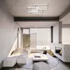 A modern living room with a fireplace, sofa, and coffee table. Náhled obrázku produktu