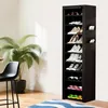 A tall, black shoe rack filled with various shoes is shown in a room with a plant and a chair. Produktbild-Vorschau