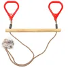 A product shot of a wooden trapeze bar with red handles and rope, isolated on a white background. Náhled obrázku produktu