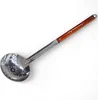 A kitchen ladle with a wooden handle, shown against a white background. Produktbild-Vorschau
