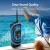 A person fishing on a boat with a radio in the foreground. Anteprima dell’immagine prodotto