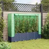 A raised garden bed with a greenhouse cover, filled with tomato plants, is set up in a backyard. Podgląd zdjęcia produktu