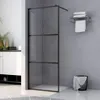 A modern bathroom with a black-framed glass shower wall. Produktbild-Vorschau