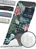 A bath mat with a marine life pattern is shown, along with several rolled-up bath mats of different designs and two adhesive hooks. Produktbild-Vorschau