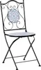 A black metal folding chair with a blue and white mosaic pattern on the seat and backrest, set against a white background. Náhled obrázku produktu
