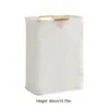 A white laundry basket with wooden handles against a white background. Náhľad obrázku produktu