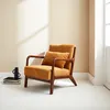 A single ocher cord armchair with a wooden frame is placed on a white floor against a cream-colored wall. Sunlight casts shadows on the wall. Anteprima dell’immagine prodotto