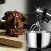 A split image showing a stack of chocolate brownies on the left and a close-up of a black stand mixer with a silver bowl on the right. Produktbild-Vorschau