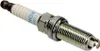 A close-up studio shot of a single spark plug against a white background. Produktbild-Vorschau
