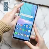 Hands holding a smartphone with a screen protector being applied. Náhľad obrázku produktu