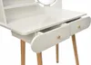 A close-up view of a white wooden dressing table with two drawers and wooden knobs, showing the top surface and legs. Produktbild-Vorschau
