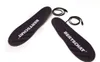 Two black insoles with white text and black wires are laid out on a white background. Anteprima dell’immagine prodotto