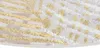 A close-up view of a textured rug with a pattern of diagonal stripes and dots in cream, brown, and gold colors on a white background. Produktbild-Vorschau