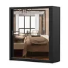 A black wardrobe with mirrored doors reflecting a bedroom interior. Produktbild-Vorschau