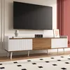 A modern TV stand with a TV mounted above it in a living room setting. Náhled obrázku produktu