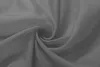 A close-up, swirled view of dark gray sheer fabric. Produktbild-Vorschau