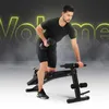 A man is performing a dumbbell row exercise on a black weight bench. The background is dark with smoky effects and large, neon yellow text that reads 'Volume'. Náhľad obrázku produktu