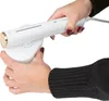Hands holding a white steam iron and its charging base. Náhled obrázku produktu