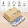 A digital scale with a cardboard box on top, showing various product features in icons and text. Produktbild-Vorschau