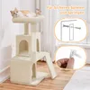 A cat is resting on a beige cat tree, which is shown in a room with wooden floors and a window in the background. There are also inset images showing how to secure the cat tree to a wall. Produktbild-Vorschau