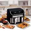 A kitchen counter with an air fryer and various food items. Podgląd zdjęcia produktu