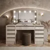 A modern bedroom with a vanity table and bed. Produktbild-Vorschau