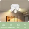A white ceiling light fixture with three adjustable spotlights is shown mounted on a ceiling. Below the light, a framed poster is visible on a textured wall. The bottom of the image contains icons and text related to the product's features. Náhľad obrázku produktu