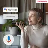 A woman is holding a remote and speaking to a smart device, with speech bubbles indicating voice commands. Produktbild-Vorschau