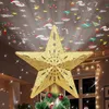 A golden star-shaped Christmas tree topper with a projector that casts festive images onto the ceiling. Produktbild-Vorschau