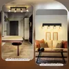 A collage showing a ceiling light fixture installed in a hallway and a wall light fixture installed in a living room. Anteprima dell’immagine prodotto