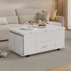 A white coffee table with storage and stools is placed in a living room setting next to a sofa. Podgląd zdjęcia produktu