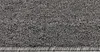 A close-up view of a gray carpet with a visible edge and fringe. Anteprima dell’immagine prodotto
