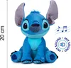 A plush toy of the character Stitch from Lilo & Stitch is sitting and facing the camera. There is a ruler on the left side indicating 20 cm and a circular graphic on the right indicating sound. Náhľad obrázku produktu