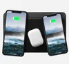 Two smartphones and a pair of wireless earbuds are placed on a black charging mat. Voir les images du produit