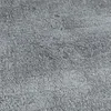A close-up, textured view of a gray surface, likely wallpaper or concrete. Produktbild-Vorschau
