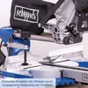 A close-up view of a miter saw, focusing on the angle adjustment mechanism and measurement markings. Voir les images du produit