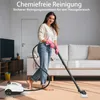 A woman is cleaning a carpet with a steam cleaner in a living room. Produktbild-Vorschau