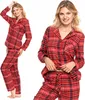 A woman modeling a red and black plaid pajama set. Produktbild-Vorschau
