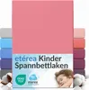 A stack of colorful fitted sheets with a pink sheet prominently displayed at the front, featuring product branding and a sleeping child. Náhľad obrázku produktu