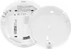 The back of a white smoke detector with its cover removed, showing internal components and labels. Voir les images du produit
