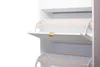 Close-up of a white shoe cabinet with three flip-down drawers. Náhľad obrázku produktu