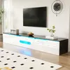 A modern living room with a TV mounted on the wall above a sleek, white TV stand with blue LED lighting. Produktbild-Vorschau