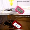 A split image showing a pink alarm clock in daylight and a red alarm clock at night. Náhled obrázku produktu