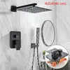 A modern black shower system installed on a marble-tiled wall, with water flowing from the showerhead. Náhled obrázku produktu
