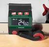 A digital measuring tool is shown on a wooden surface with a ruler. Anteprima dell’immagine prodotto