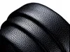 A close-up, detailed view of stacked black leather belts. Anteprima dell’immagine prodotto
