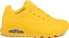 A single yellow Skechers sneaker is shown from the side against a white background. Voir les images du produit